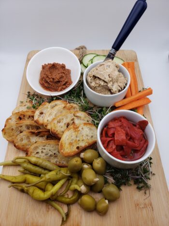 Image of Groix & Nature smoked mackerel rillettes on a board with pickled vegetables and crostini