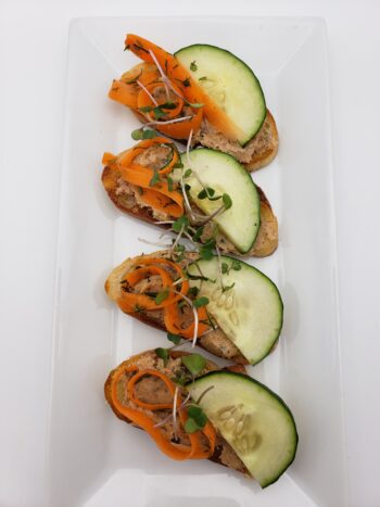 Image of Groix & Nature sardine rillettes on crostini with cucumber and carrot