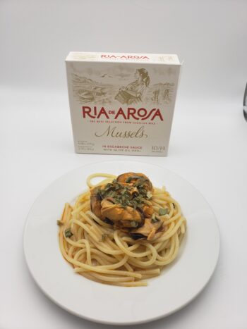 Ortiz Ria de Arosa Mussles in Escabeche 10/14 plated with pasta and chives