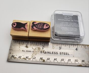 Image of small fish rubber stamps with ruler