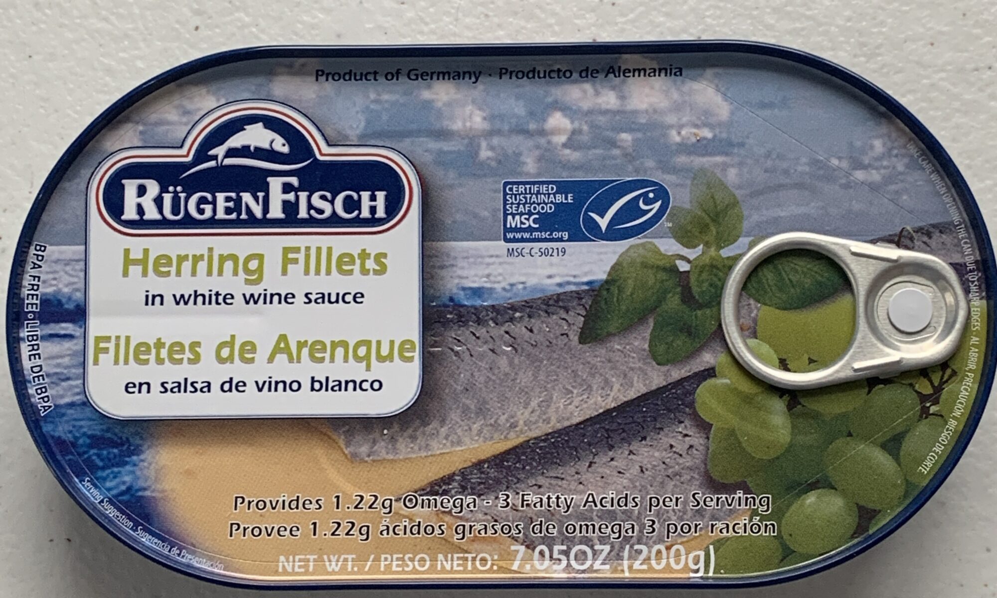 Image of the front of a tin of Rügen Fisch Herring Fillets in White Wine Sauce