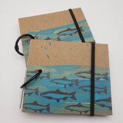 Image of handmade fish book with elastic closure