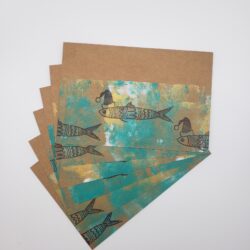 Image of santa sardine postcards hand printed fanned out