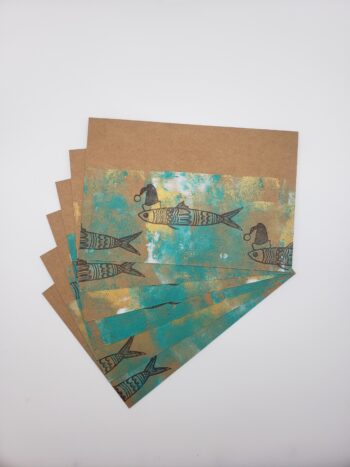 Image of santa sardine postcards hand printed fanned out
