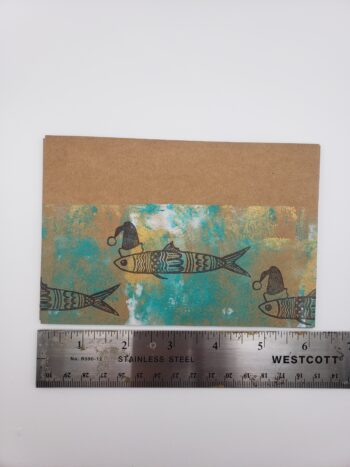 Image of santa sardine postcards hand printed with ruler