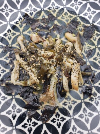 Image of Porto Muinos razor clams with sea spaghetti plated with yuzu koshu dressing and sesame seeds