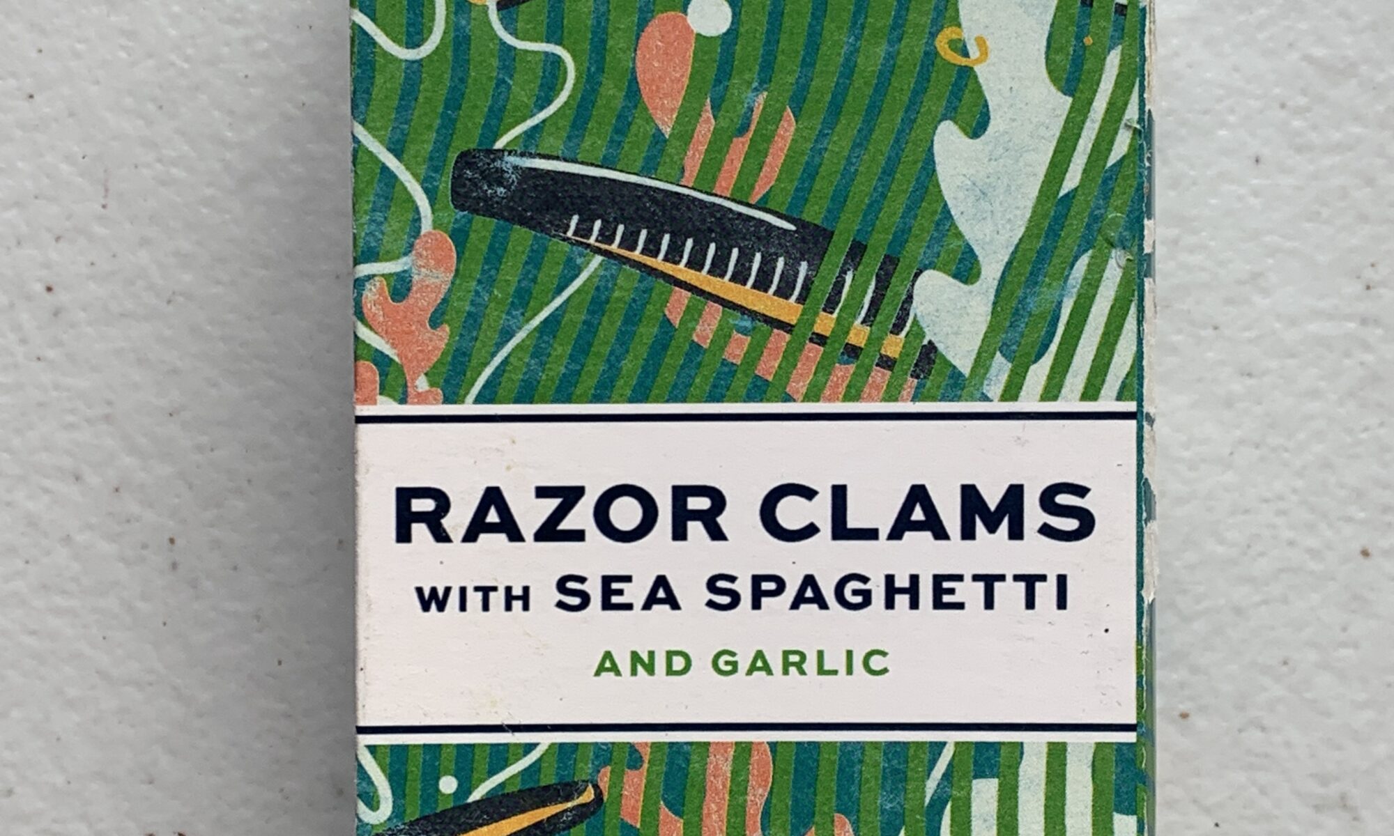 Image of the front of a package of Porto-Muiños Razor Clams with Sea Spaghetti and Garlic