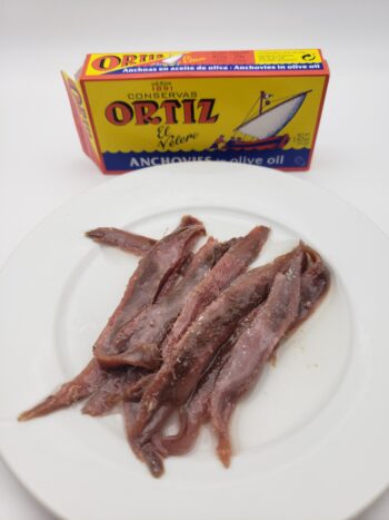 Image of Ortiz anchovies in tin on plate