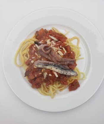 Image of anchovies in puttanesca sauce