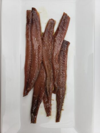 Image of Don Bocarte anchovies on plate close up