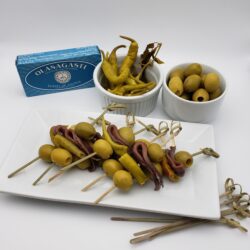 Image of gildas full set with olasagastianchovies, guindillas peppers, manzanilla olives, and bamboo skewers