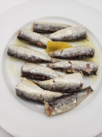 Image of Real Conservas sardinillas with lemon on plate