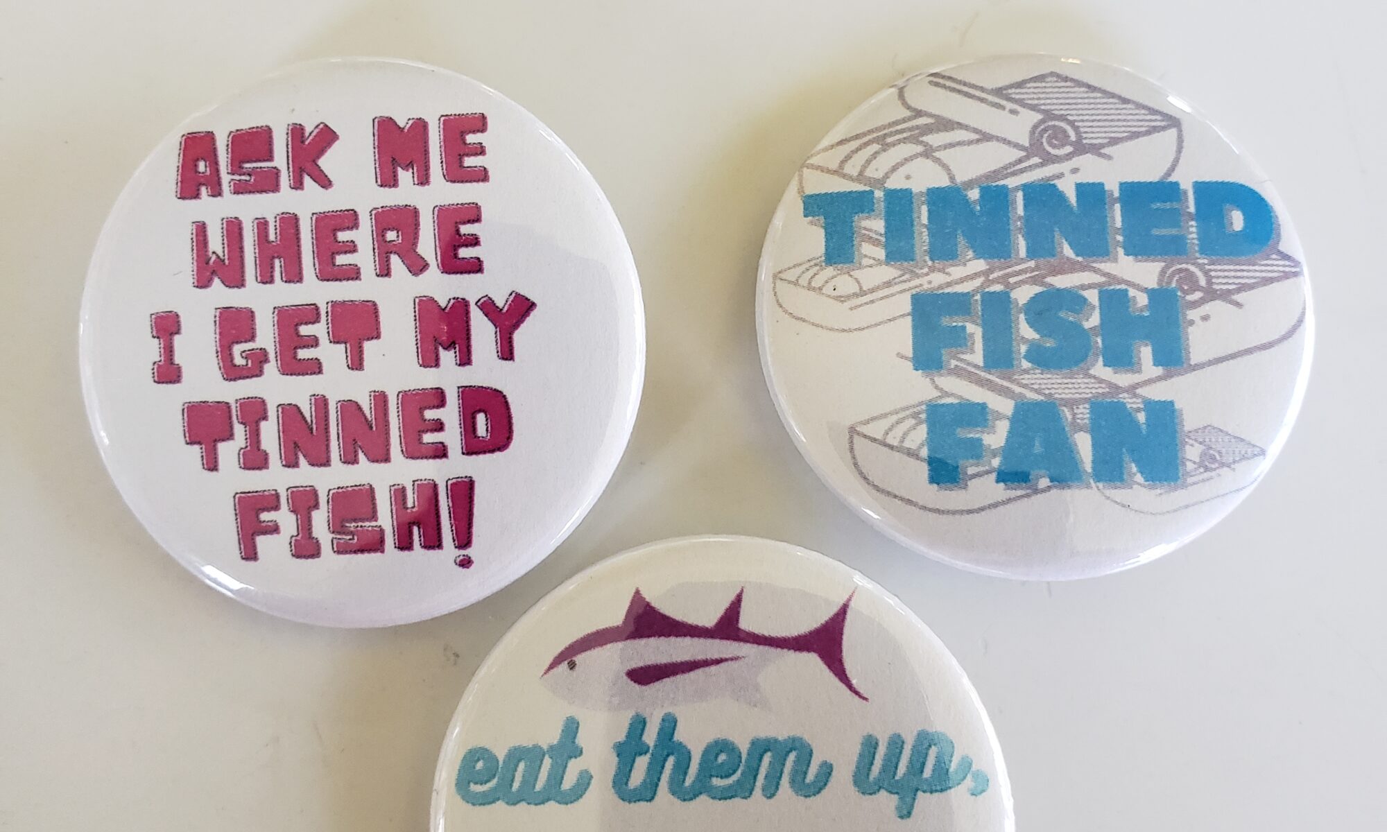 Image of various tinned fish buttons