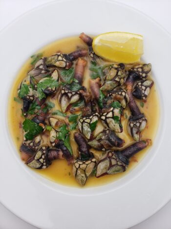 Image of Conservas de Cambados barnacles in brine with herbs butter and lemon