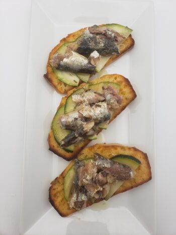 Image of Pollastrini vintage 2020 sardines in olive oil on cheddar guindilla toasts
