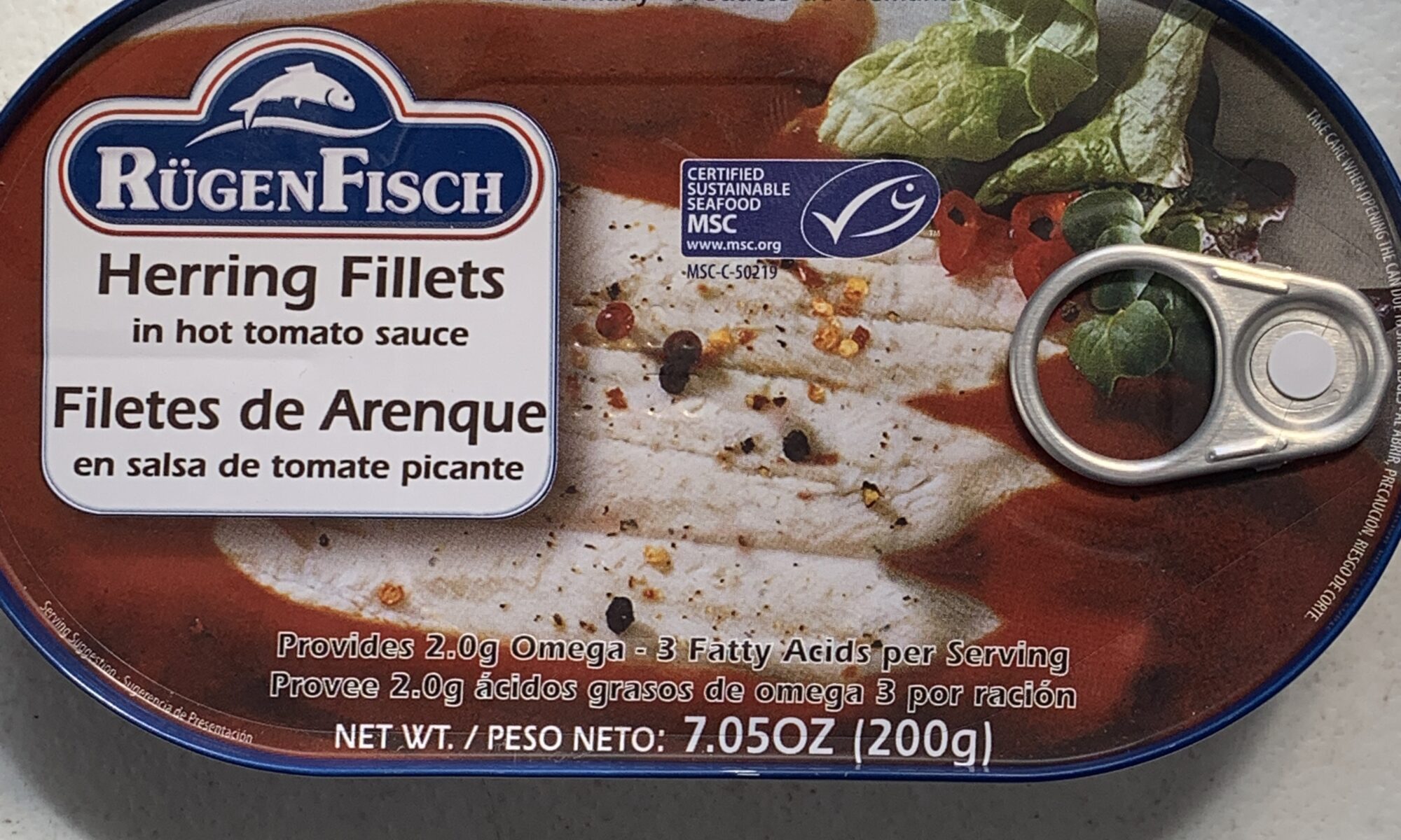 Image of the front of a tin of Rügen Fisch Herring Fillets in Hot Tomato Sauce
