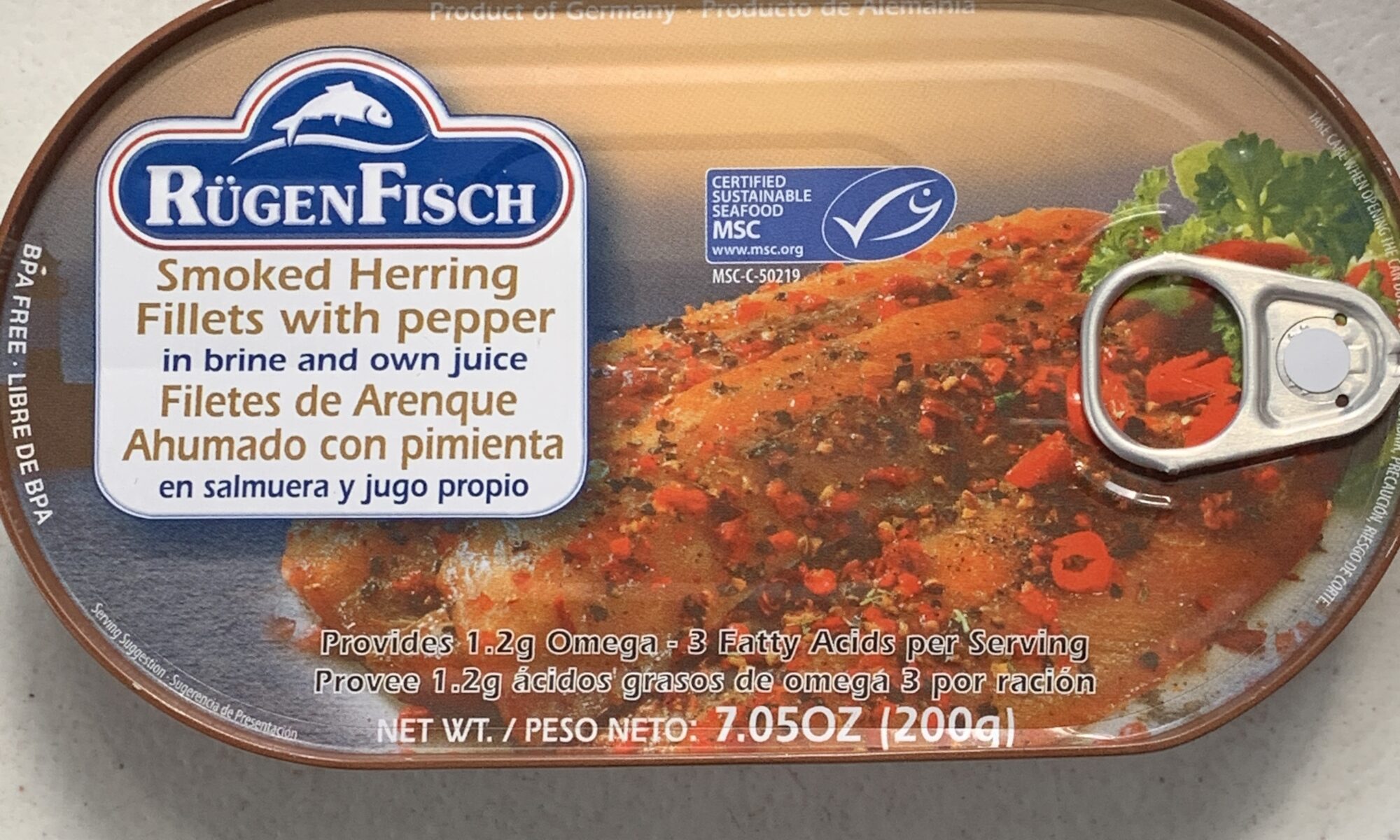 Image of the front of a tin of Rügen Fisch Smoked Herring Fillets with Pepper, in Brine and Own Juice