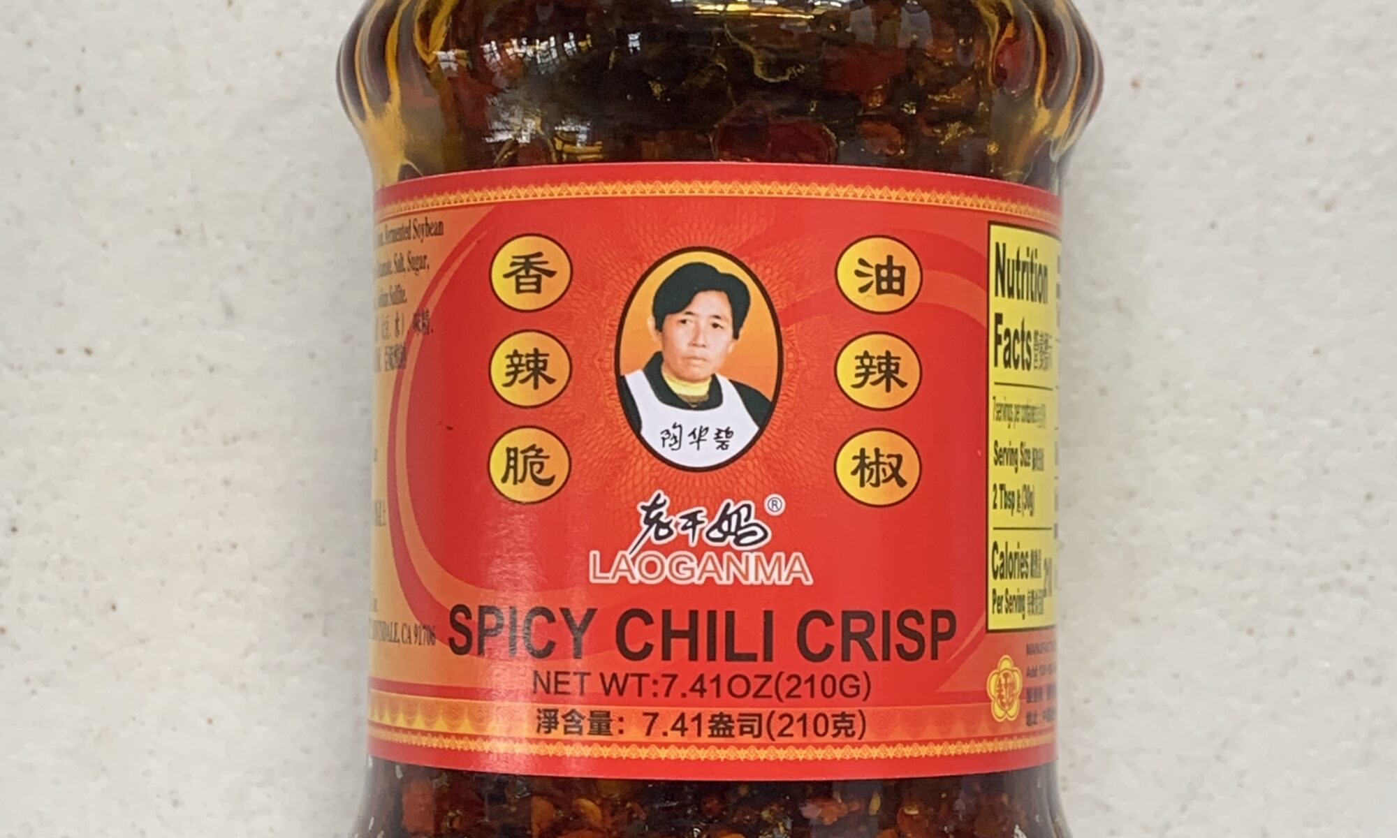 Image of the front of a jar of Lao Gan Ma Spicy Chili Crisp, 210g (7.41 oz ) glass jar