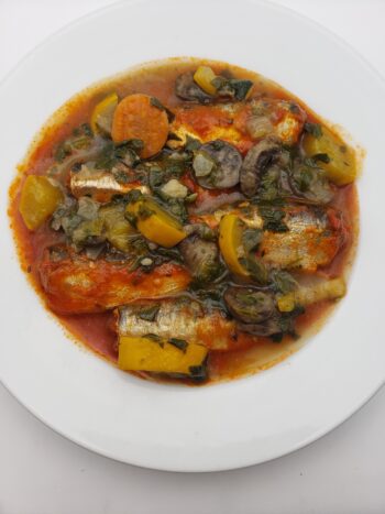 Image of Ferrigno sardines a la tropezienne plated with squash and spinach
