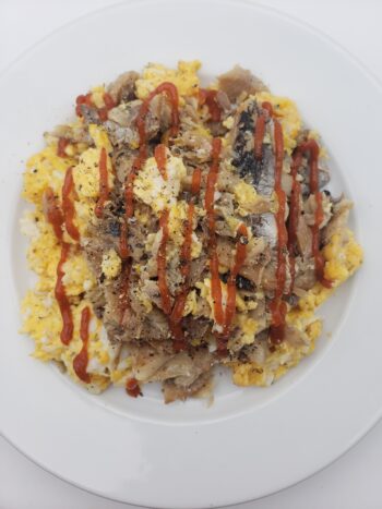 Image of Mary Manette smoked herring plated with scrambled eggs
