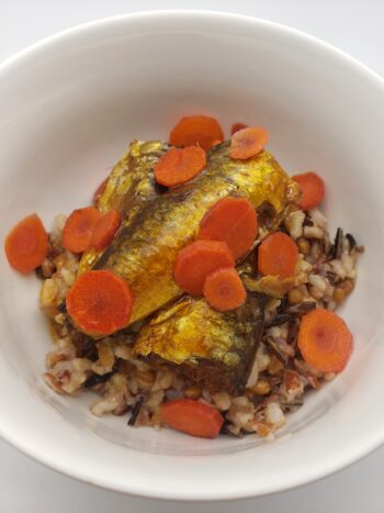 Image of Porthos sardines in terikaya sauce plated on wild rice with pickled carrots