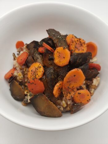 Image of Tiny Fish Co. rockfish in soy sauce plated on wild rice with pickled carrots