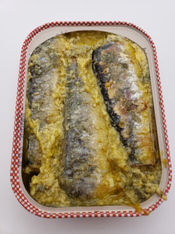Image of Ferrigno sardines with butter, garlic, and parsley open tin view