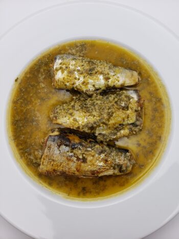 Image of Ferrigno sardines with butter, garlic, and parsley heated and plated