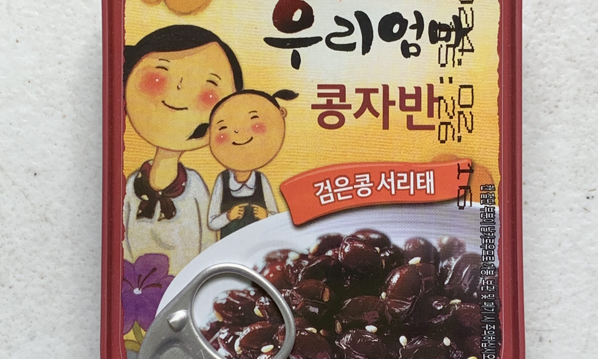 Image of the front of a tin of Sempio Braised Black Beans in Soy Sauce
