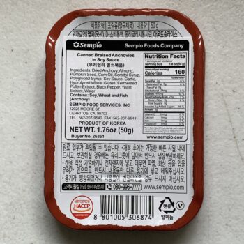 Image of the back of a tin of Sempio Braised Anchovies in Soy Sauce