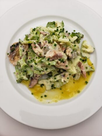 Image of Ferrigno sardines in rapeseed oil plated with celery, wing bean, and lemon salad