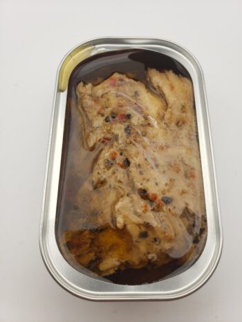 Image of Ocean's mackerel with red pepper, olives, and herbs open tin view