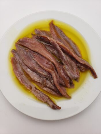 Image of Rizzoli anchovies in olive oil on plate