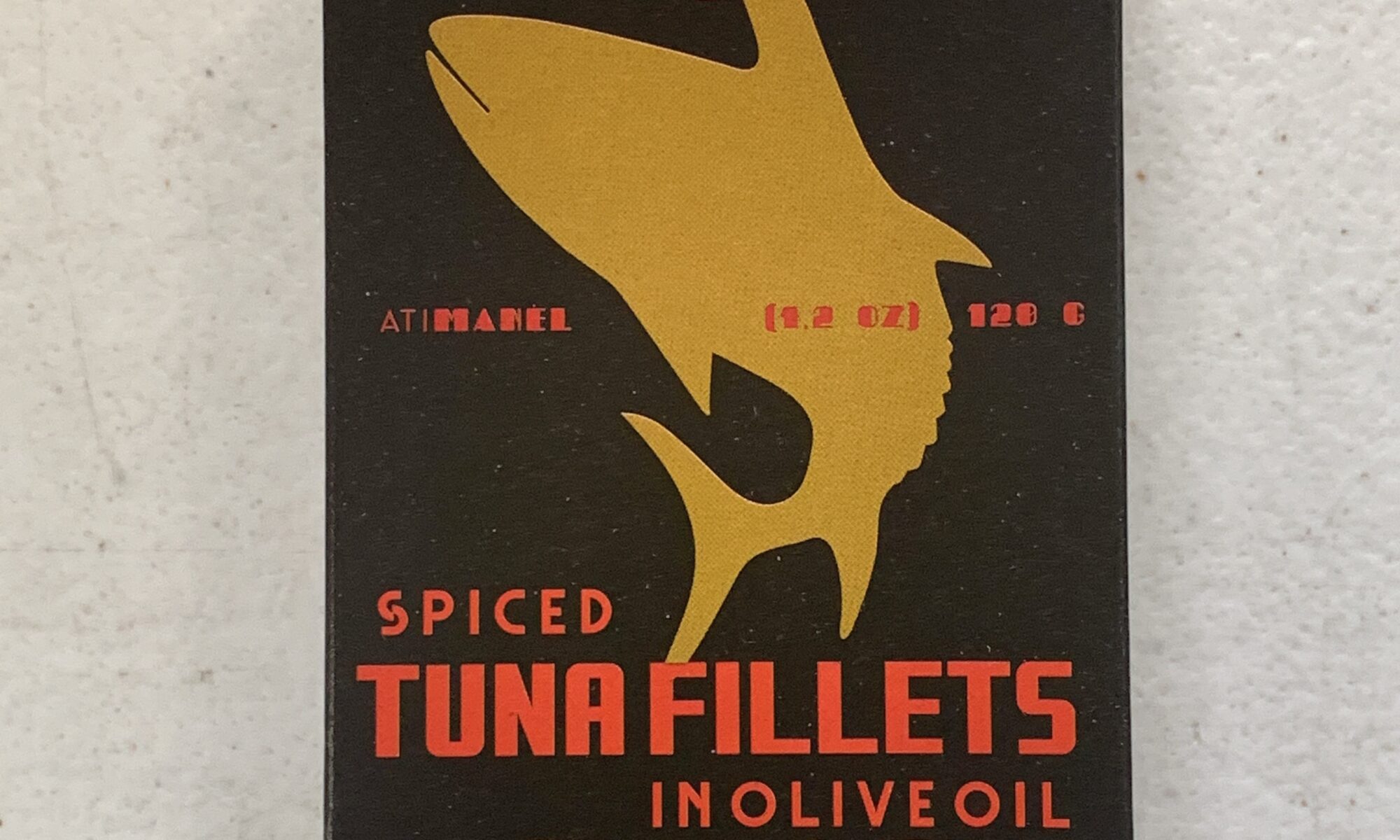Image of the front of a package of Ati Manel Spiced Tuna Fillets in Olive Oil