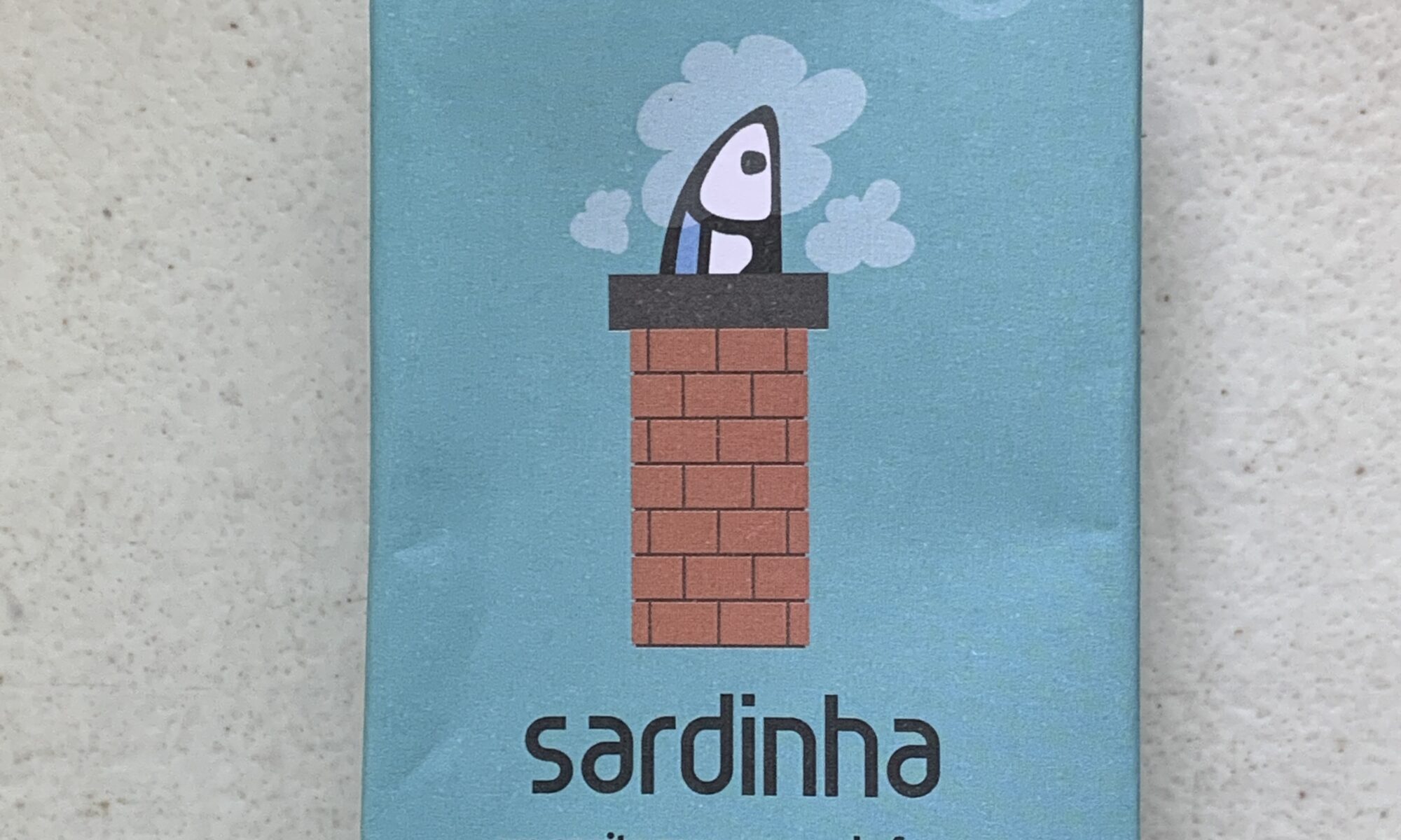 Image of the front of a package of Sardinha Lightly Smoked Sardines in Olive Oil