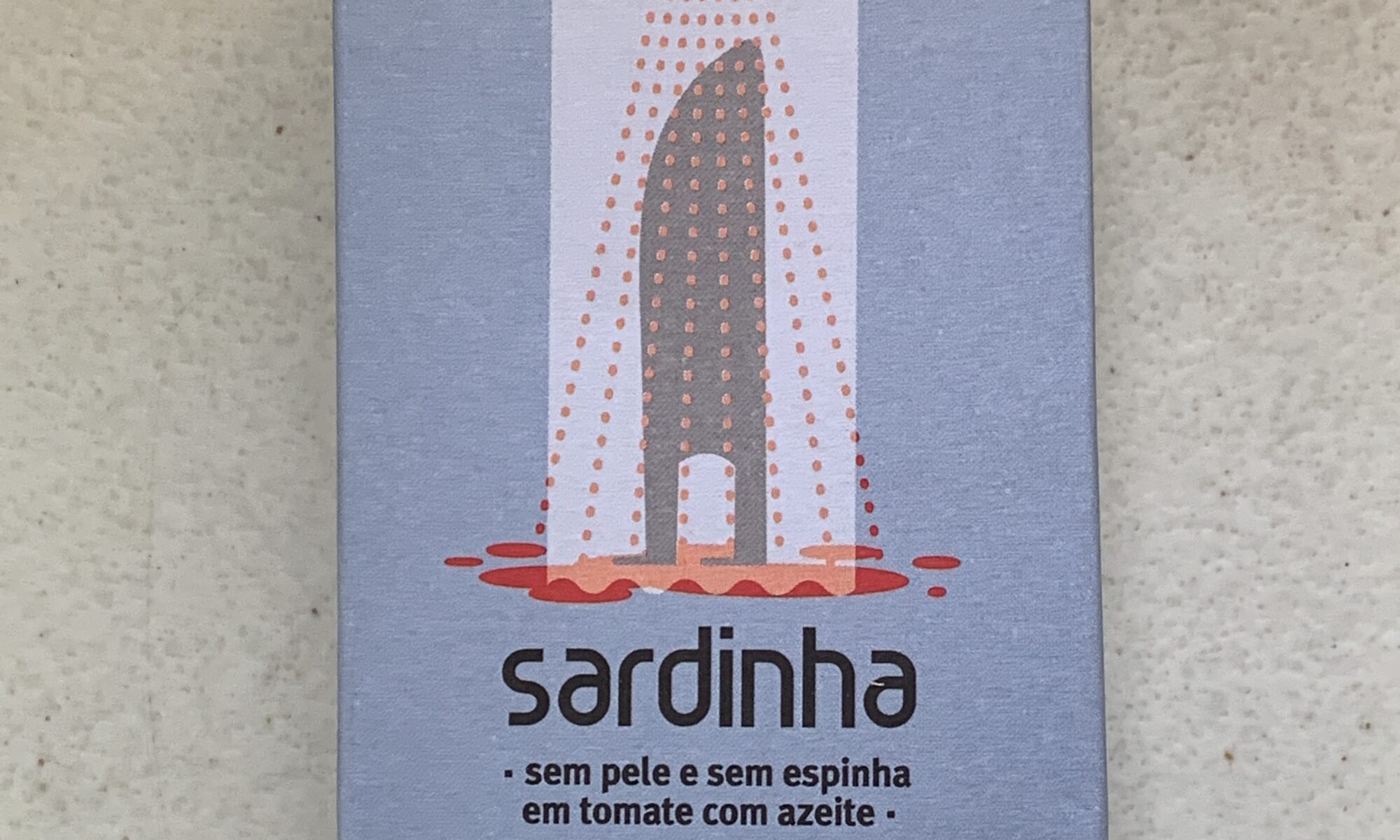 Image of the front of a package of Sardinha Skinless and Boneless Sardines in Tomato Sauce with Olive Oil