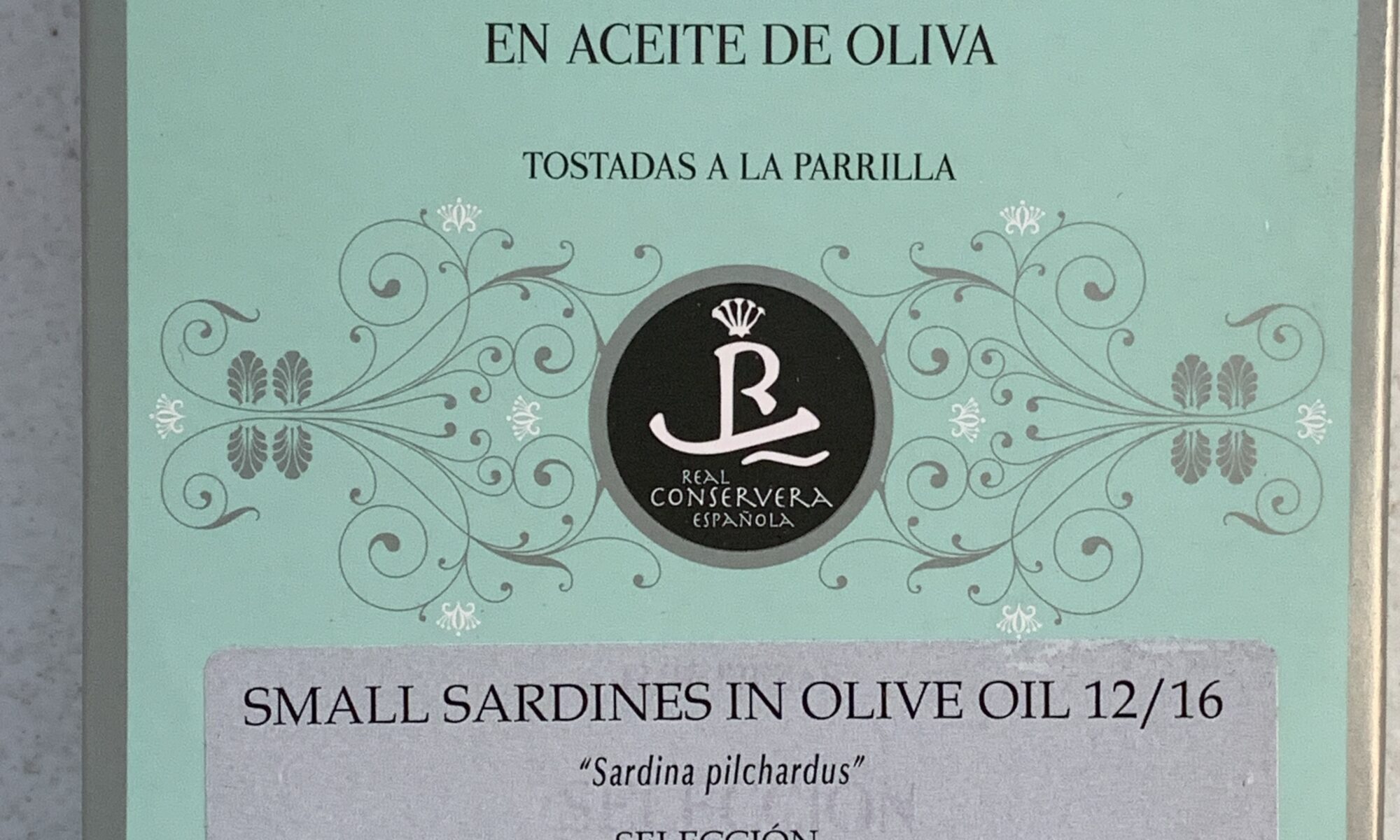 Image of the front of a package of Real Conservera Selección 1920 Small Sardines (Sardinillas) in Olive Oil 12/16