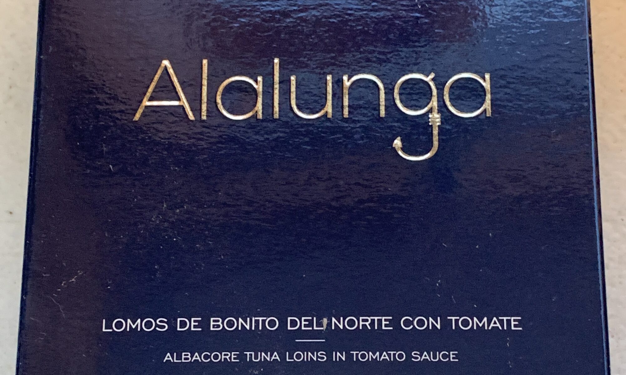 Image of the front of a package of Artesanos Bonito del Norte (Albacore) Loins in Tomato Sauce