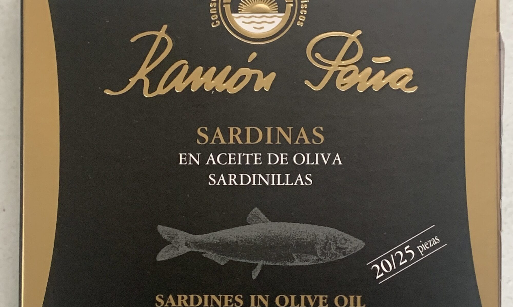 Image of the front of a package of Ramón Peña Sardines in Olive Oil 20/25, Gold Line
